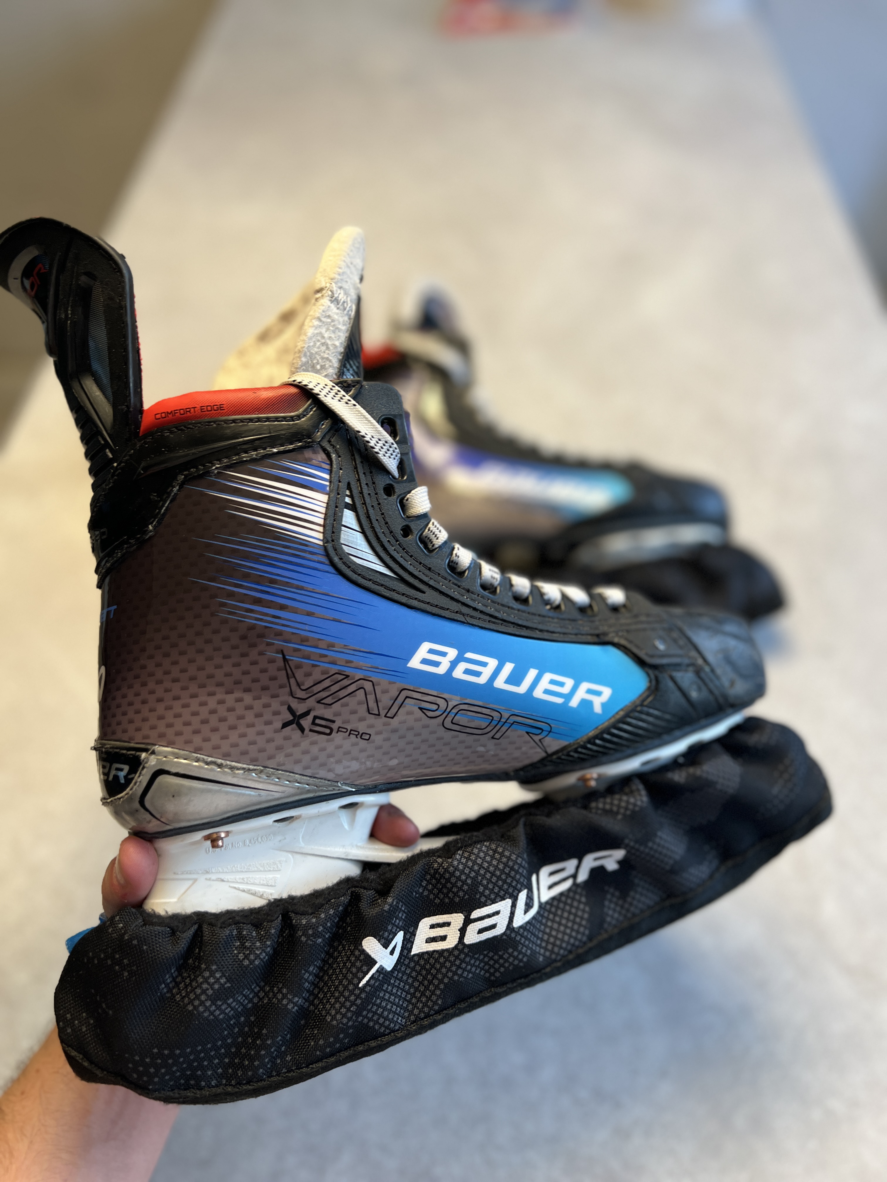Blue custom wrapped Bauer Vapor hockey skate close up